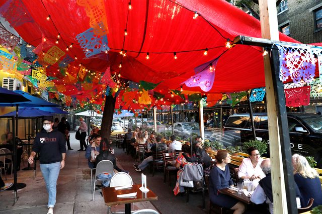 People dine outdoors at Ariba Ariba Mexican restaurant in New York.